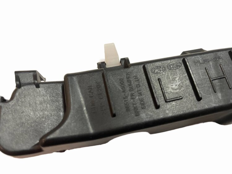 Wspornik ślizg mocowanie zderzaka przedniego LEWY 86513-A6000 Hyundai i30 2012-2017